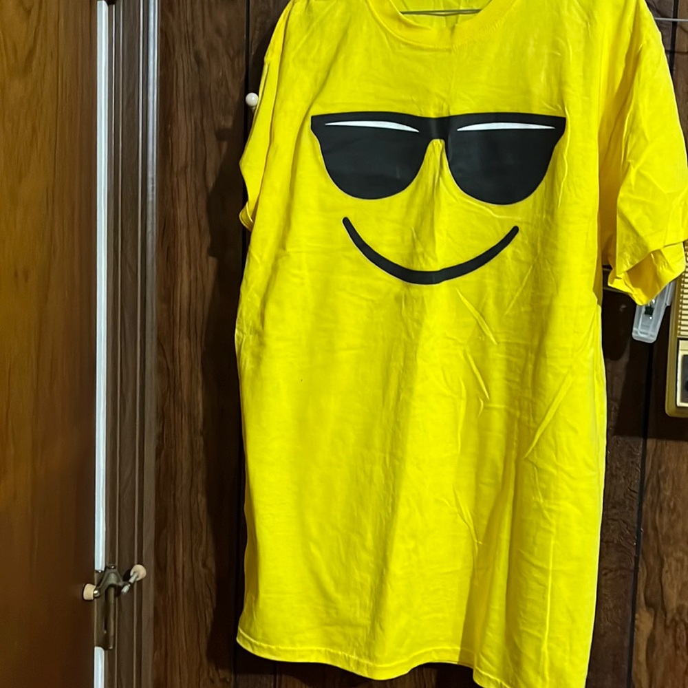 Yellow t shirt  with smile and sunglasses.